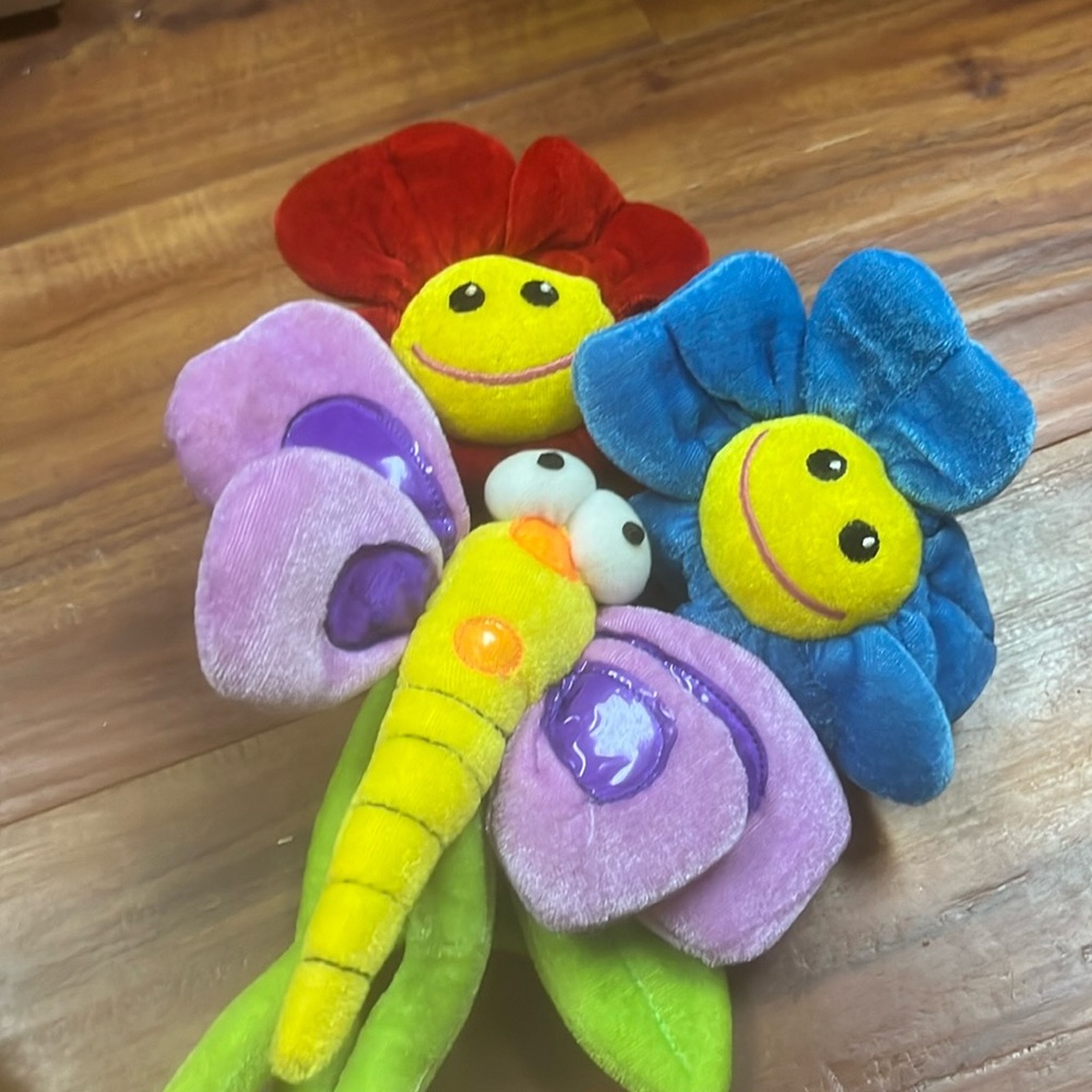 Two posable flowers and one posable firefly